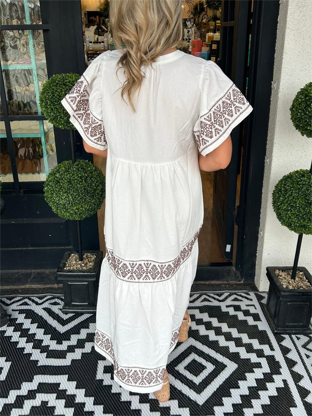 Elegant bohemian style women's midi dress. Embroidered A-line design, long sleeve, great for spring summer fashion.
