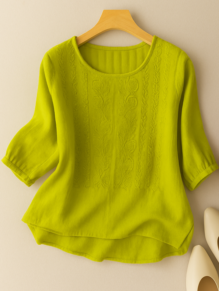 Chic women's embroidered blouse, a versatile relaxed fit top for elegant casual fashion and seasonal style.