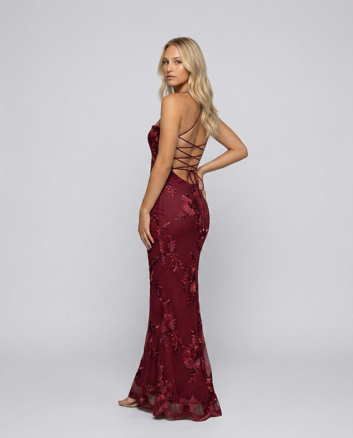 Summer-ready women's maxi dress, vibrant floral appliqué & a playful lace-up back for elegance.