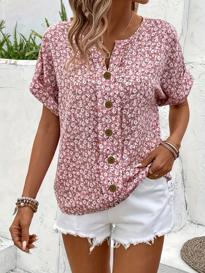 Chic women's button-up floral blouse, elegant and versatile. Ideal for summer and spring fashion.