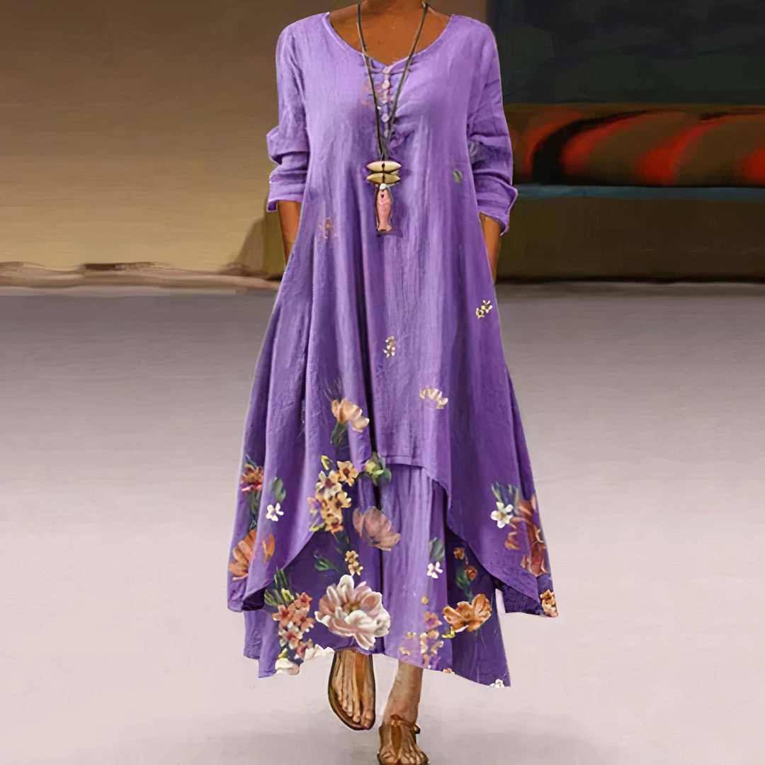 Flowy women's long sleeve maxi dress with vibrant floral border print. Comfortable and stylish for any occasion.