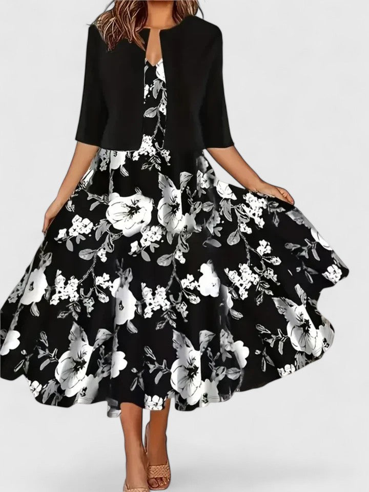 Chic women's midi dress featuring vibrant floral print, stylish colorblock design & A-line silhouette.