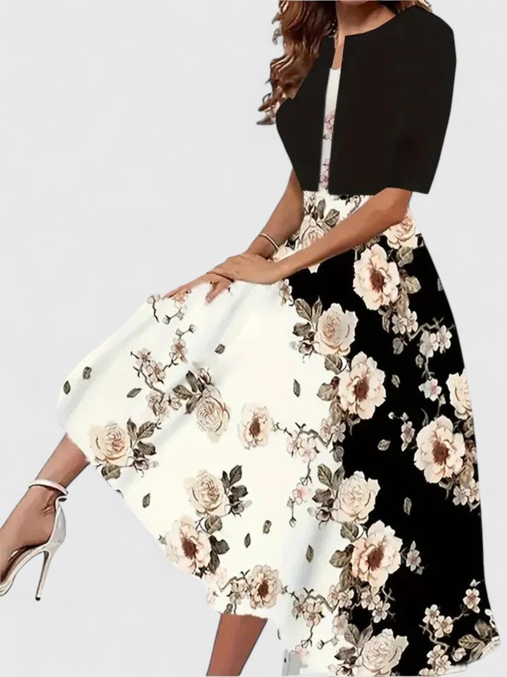 Beautiful women's floral print midi dress. A-line cut, elegant colorblock detail & flattering notch neck.