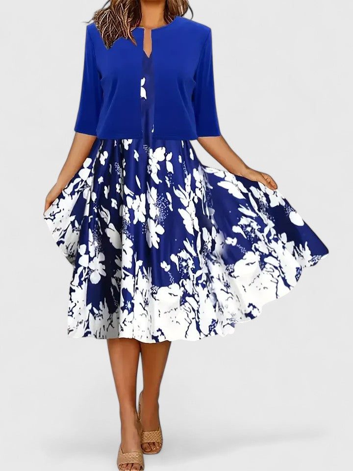 Women's party-ready midi dress: vibrant floral print, elegant colorblock, A-line fit & notch neck.