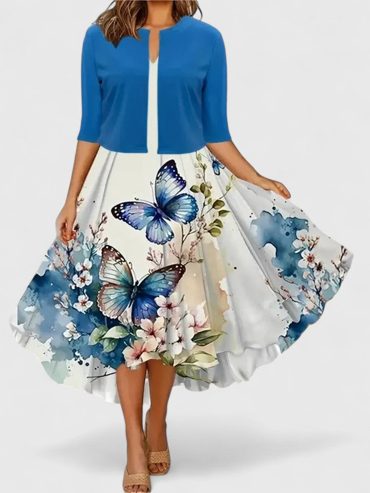 Spring fashion: women's chic floral A-line midi dress, colorblock panels & distinctive notch neckline.