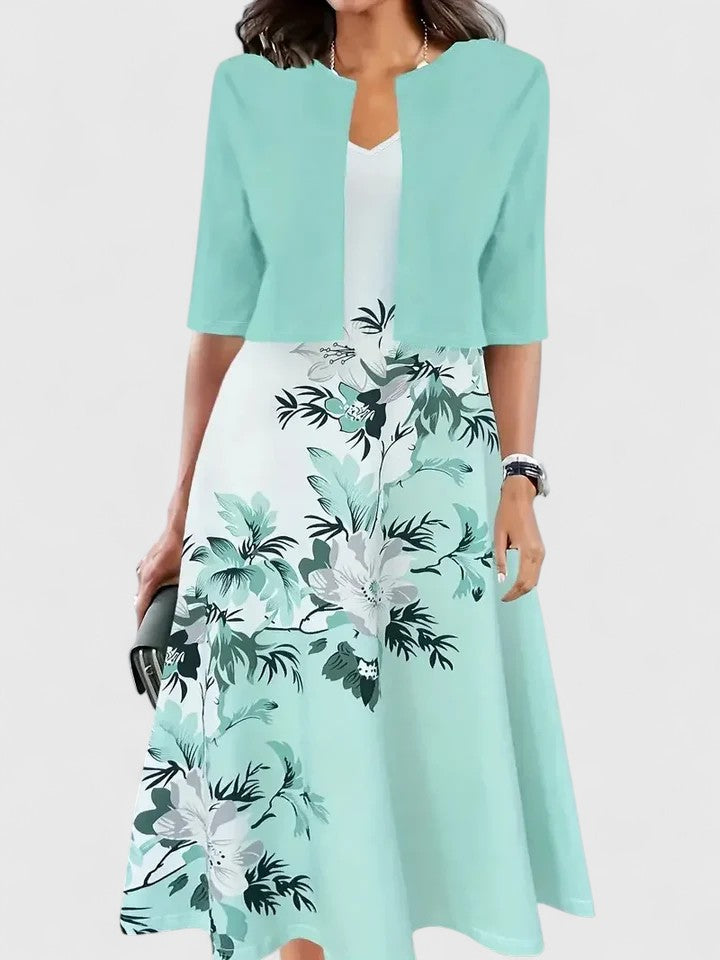 Elegant women's occasion dress. Floral print, bold colorblock, A-line midi length & stylish notch neck.
