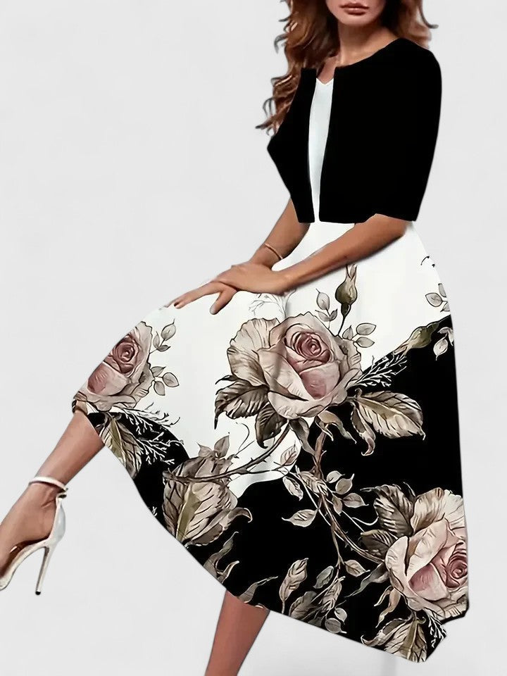 Women's fashionable A-line midi dress, featuring a striking floral colorblock pattern & notch neck.