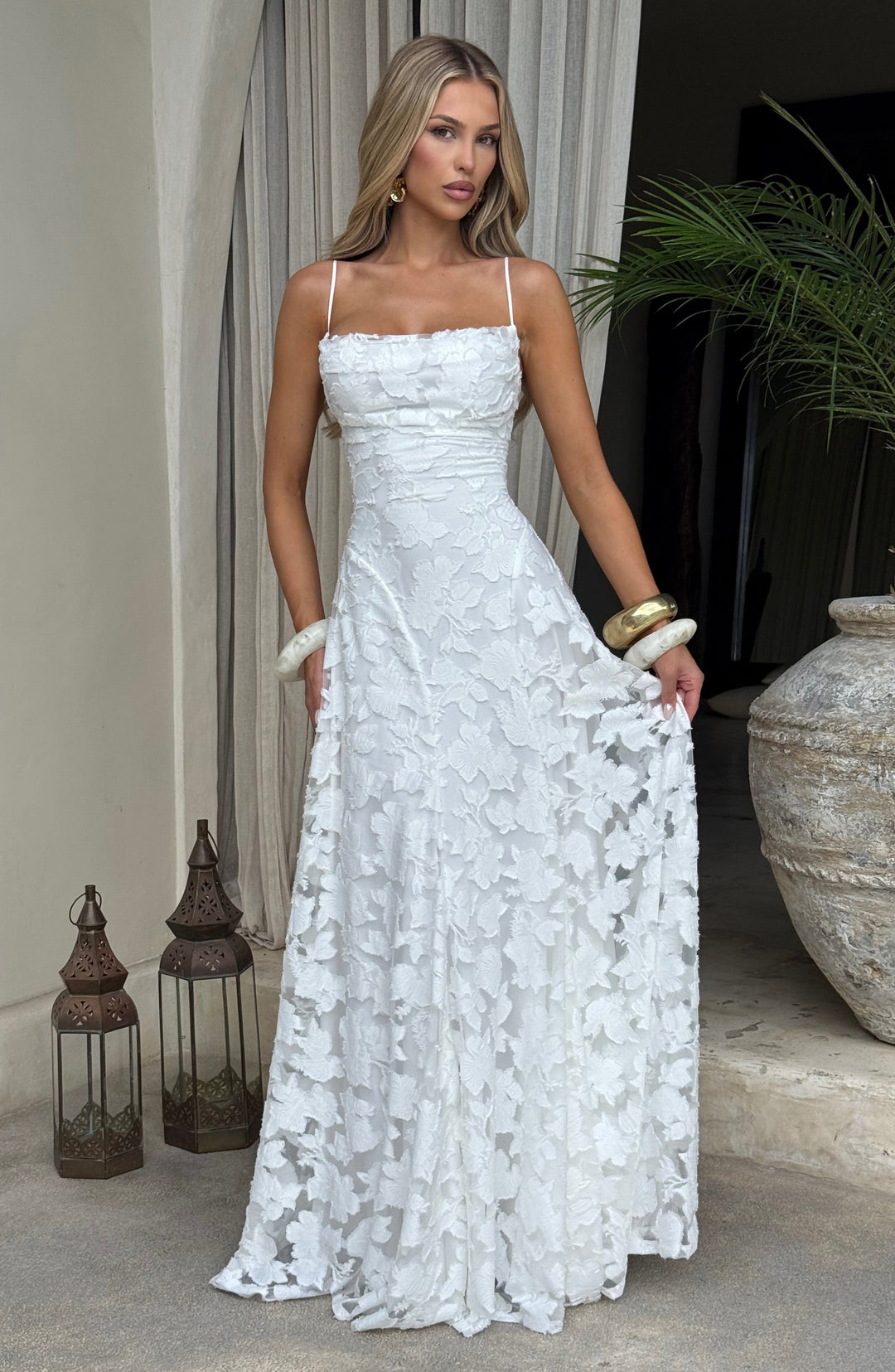 Full length shot of the women's floral maxi dress on a model, highlighting its elegant A-line silhouette.