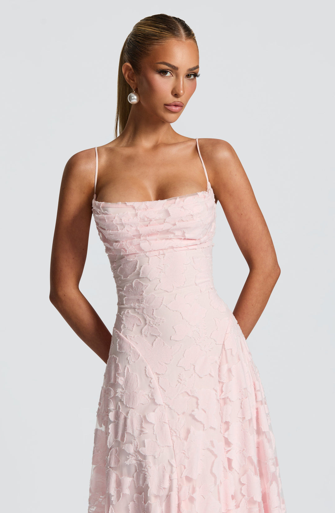 Sophisticated women's evening floral dress with a striking waterfall neckline and long, elegant drape.
