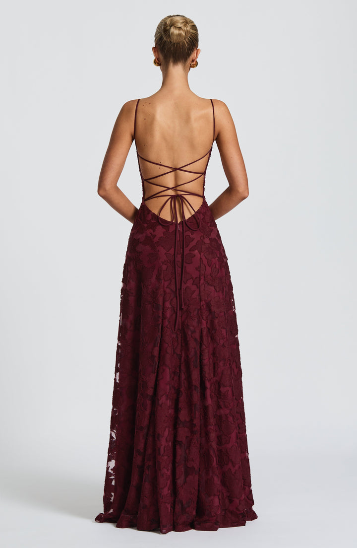 Women's elegant floral maxi dress for parties, featuring a sleeveless design, waterfall neckline & lace-up back.