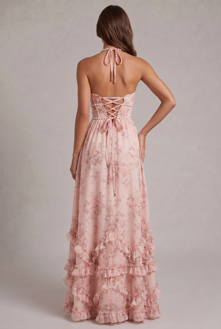 Elegant women's halter neck maxi dress in a vibrant floral pattern. Perfect party or evening gown.