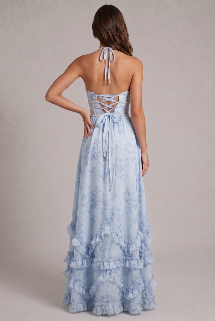Vibrant floral print women's maxi dress with a chic halter neck, ideal for elegant summer parties.