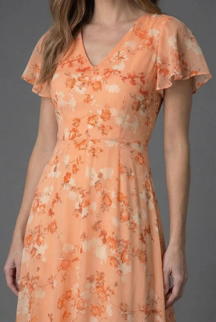 Flowy floral maxi dress for women featuring a V-neck & delicate flutter sleeves. Ideal for spring & summer events.