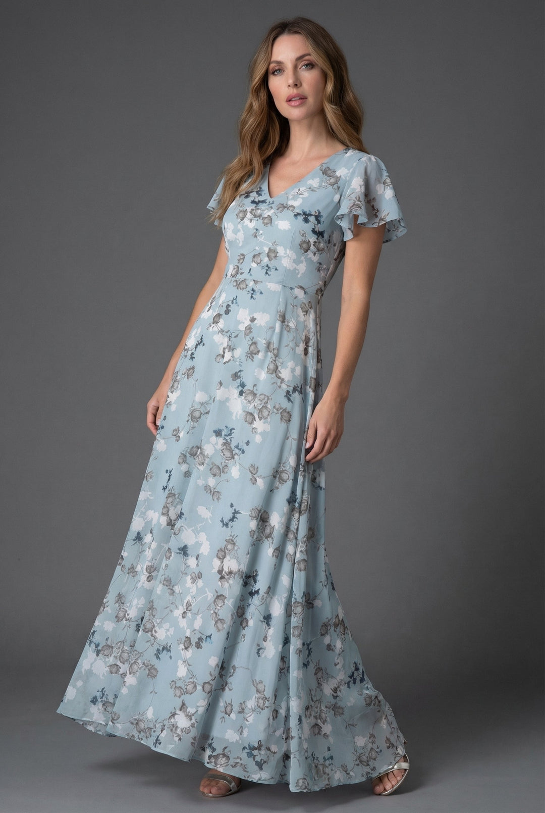 Vibrant floral print maxi dress for women with graceful flutter sleeves & flattering V-neckline. Summer fashion.