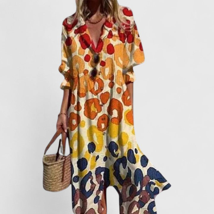 Women's beautiful floral print midi shirtdress with pintuck detailing and a comfortable pleated skirt.