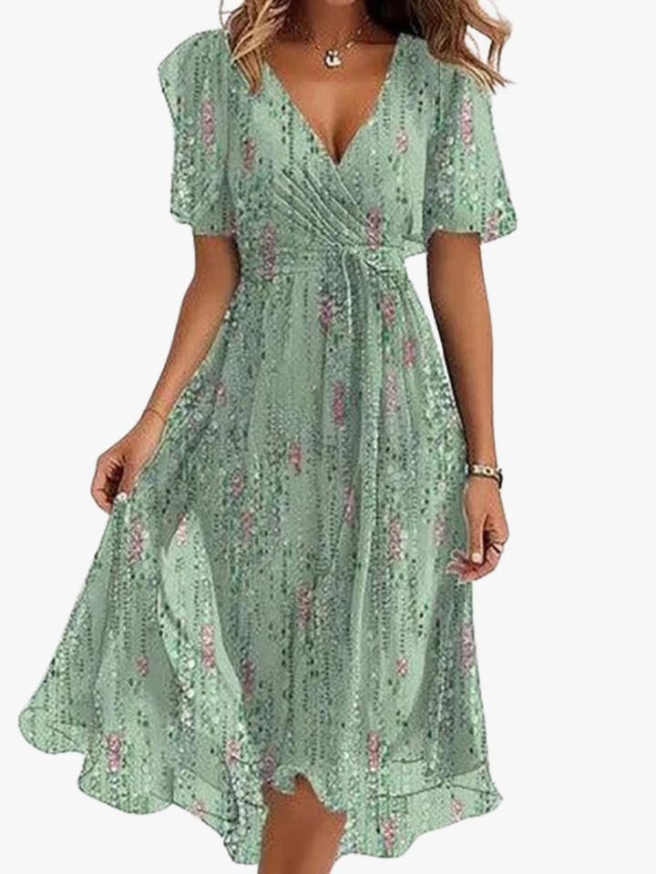 Women's elegant floral print wrap V-neck midi dress with flutter sleeves & ruffle hem for summer.