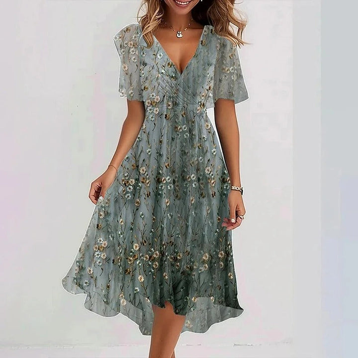 Women's summer occasion midi dress, featuring a wrap V-neck, flutter sleeves, and ruffle hem design.
