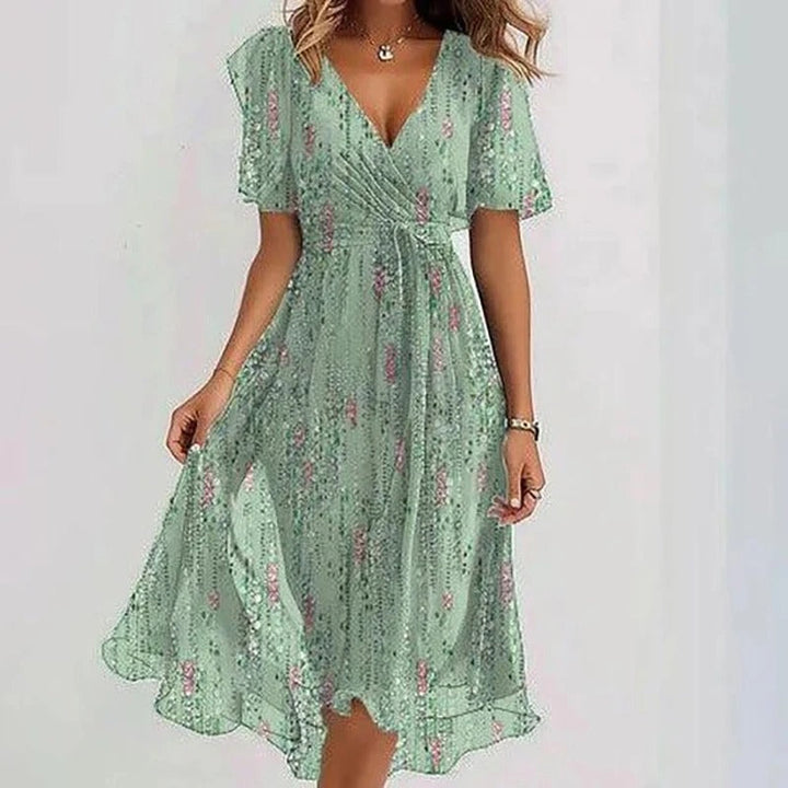 Flowy women's wrap V-neck flutter sleeve midi dress, perfect for elegant casual summer style & occasions.