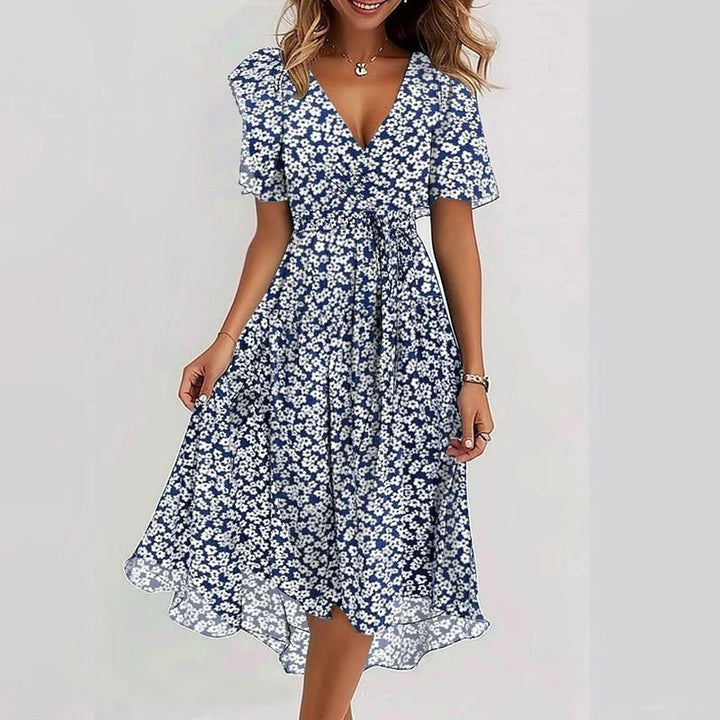 Stylish women's midi dress featuring a wrap V-neck, flutter sleeves, and a chic ruffle hem.