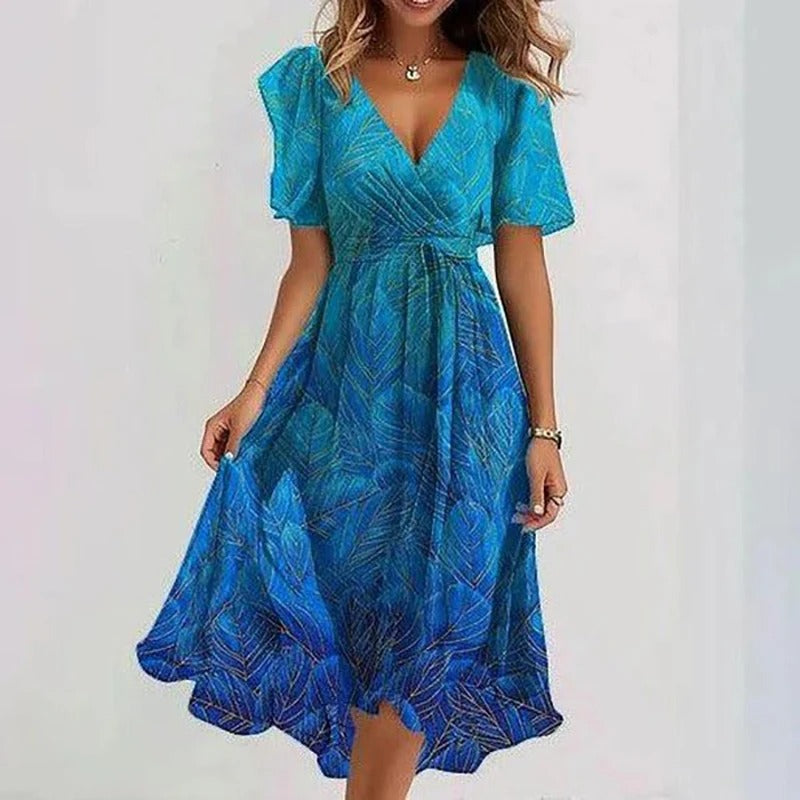 Versatile floral print women's midi dress with a flattering wrap V-neck and flutter sleeves.