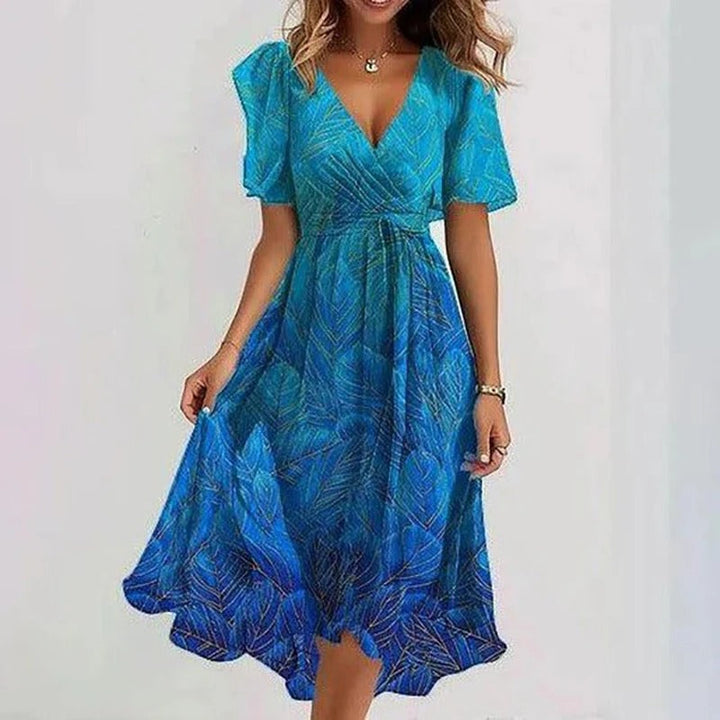 Versatile floral print women's midi dress with a flattering wrap V-neck and flutter sleeves.