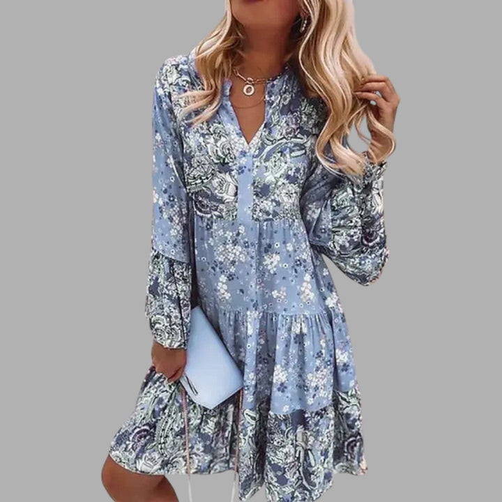 Flowy women's midi dress with vibrant floral print. Elegant design suitable for parties, summer, or special events.