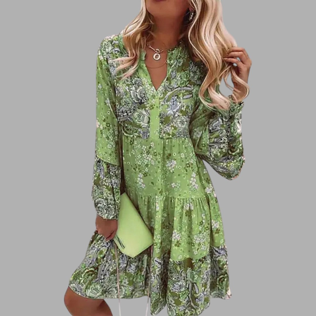 Elegant women's floral midi dress, showcasing its beautiful print and flattering cut. Ideal for summer and parties.