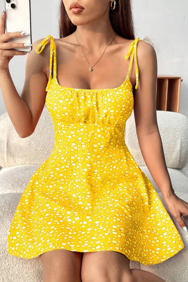 Detailed view of the elegant floral pattern on a women's strapless slip dress, ideal for summer.