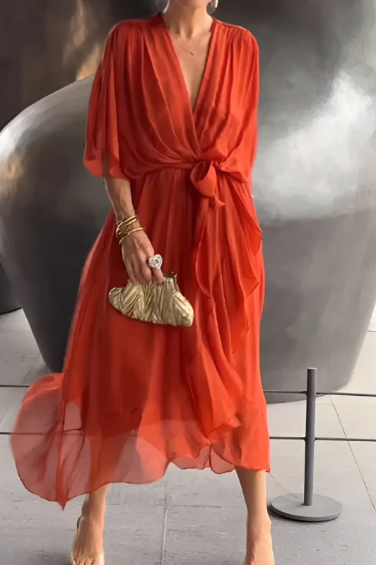 Full-length view of an elegant women's flowing maxi dress, highlighting its graceful design for special events.