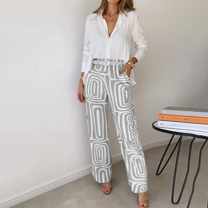 Versatile women's two-piece set: elegant flowing top & patterned trousers, suitable for various occasions.