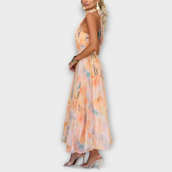 Women's elegant halter neck open-back maxi dress, ideal as a party or beach wedding summer occasion dress.
