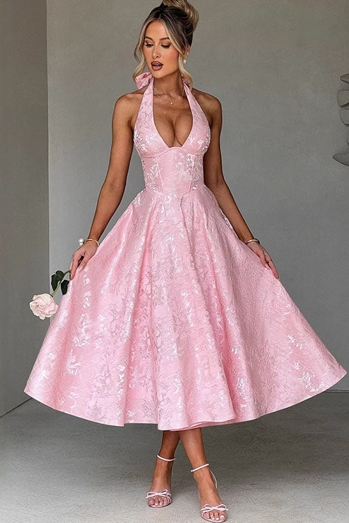 Women's elegant halterneck maxi dress for formal evening events.