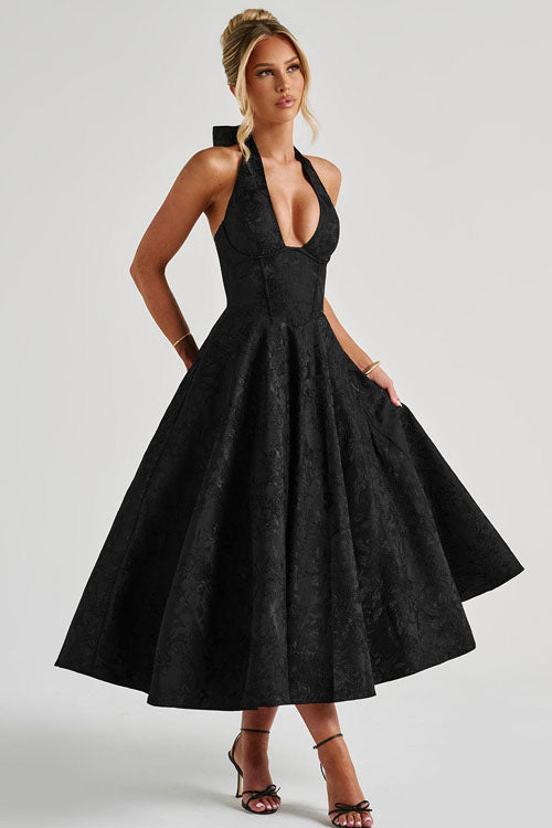 Women's sophisticated halterneck maxi gown, formal evening attire.