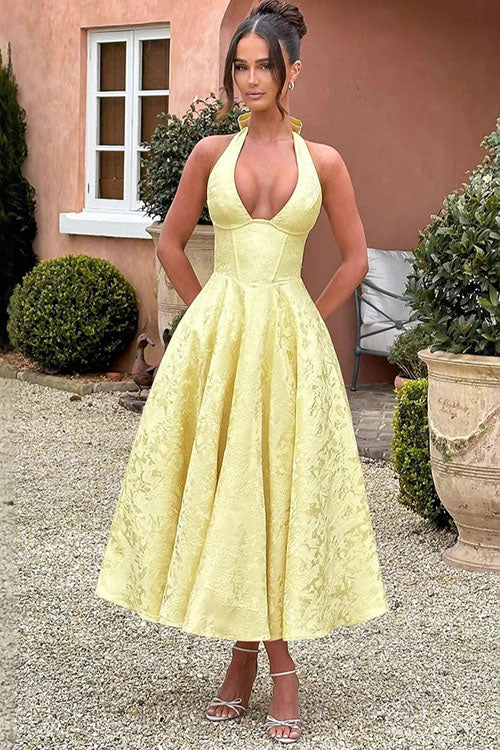 Long halterneck formal dress for special occasion celebrations.