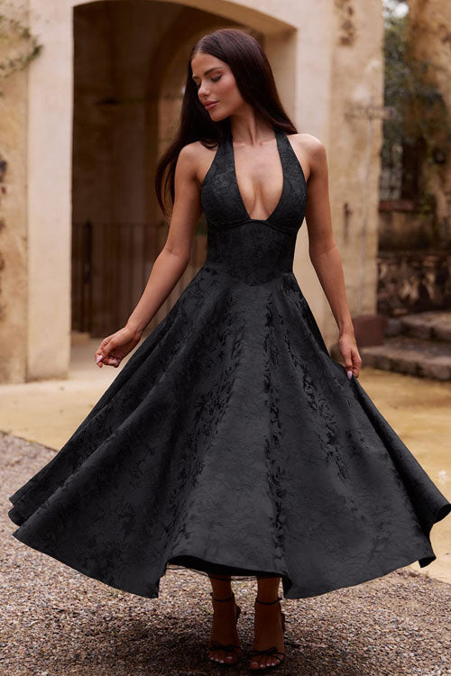 Flowy women's halterneck maxi dress, an elegant party gown.
