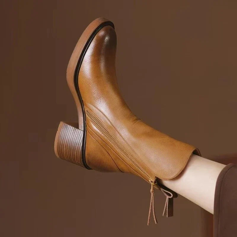 Women's elegant high heel ankle boots with zipper, ideal for evening, party, & formal wear.
