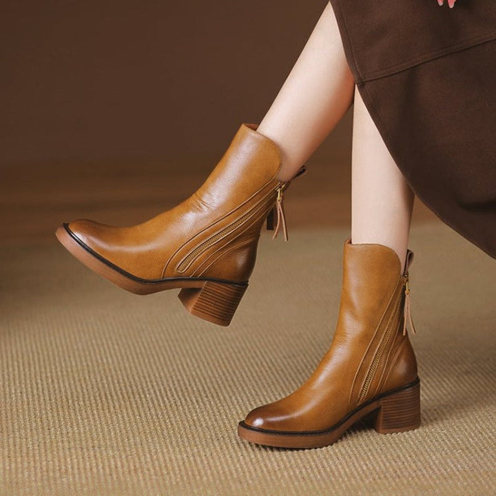 Versatile women's high heel ankle boots with zipper, comfortable for evening events, parties, & formal occasions.