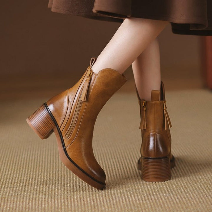 Elegant women's zippered high heel ankle boots for evening, party, & formal wear. Sleek and fashionable design.