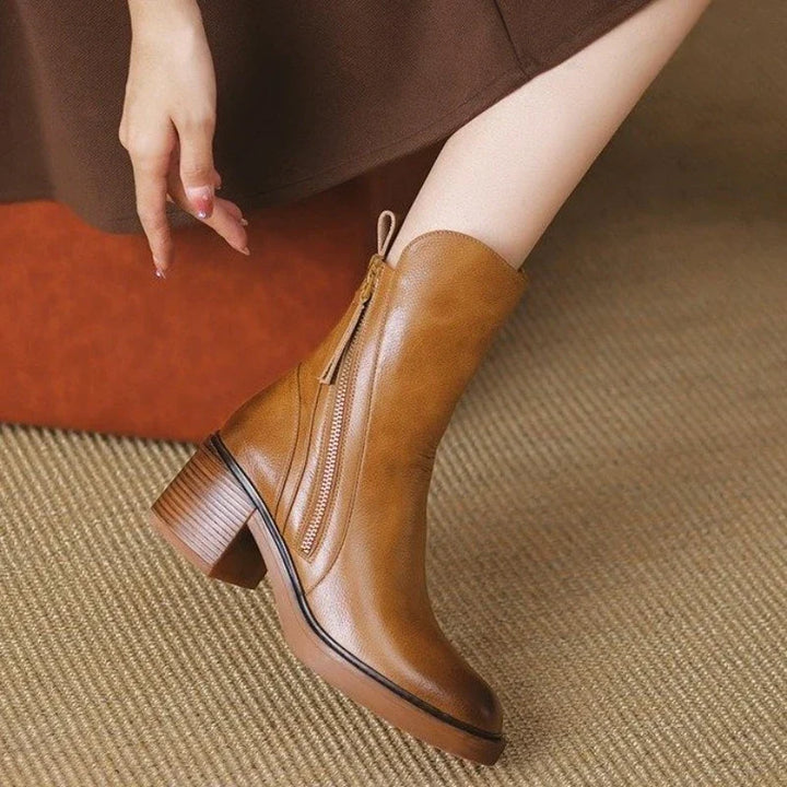 Fashionable women's high heel ankle boots with zipper, adding elegance to evening, party, & dress outfits.