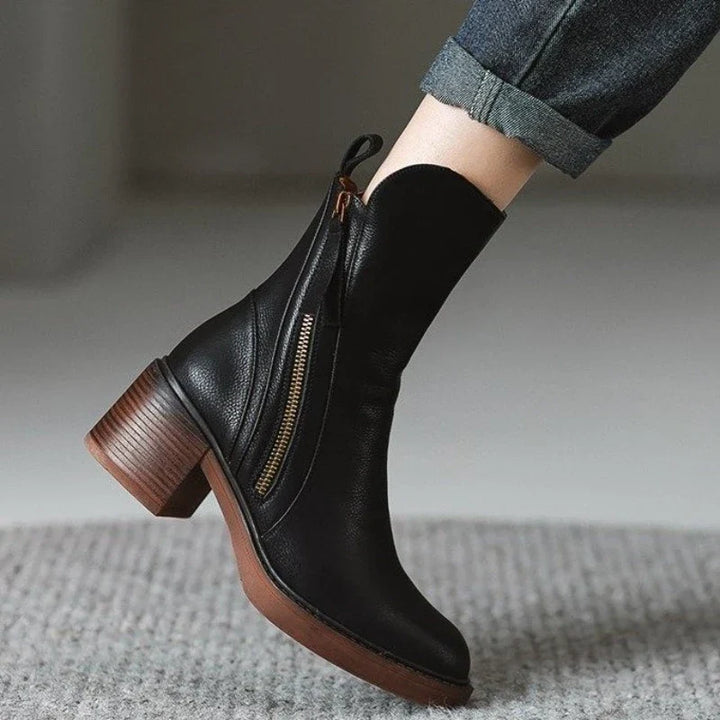 Sleek women's high heel ankle boots, zippered, for sophisticated evening parties, formal events & fashion.
