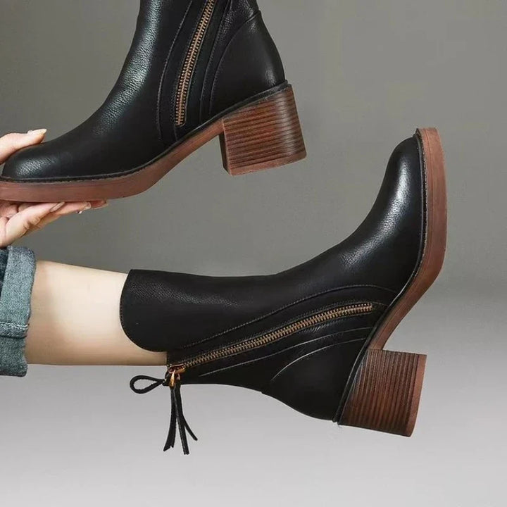 Comfortable women's high heel ankle boots with zipper, elegant for evening fashion & party footwear.