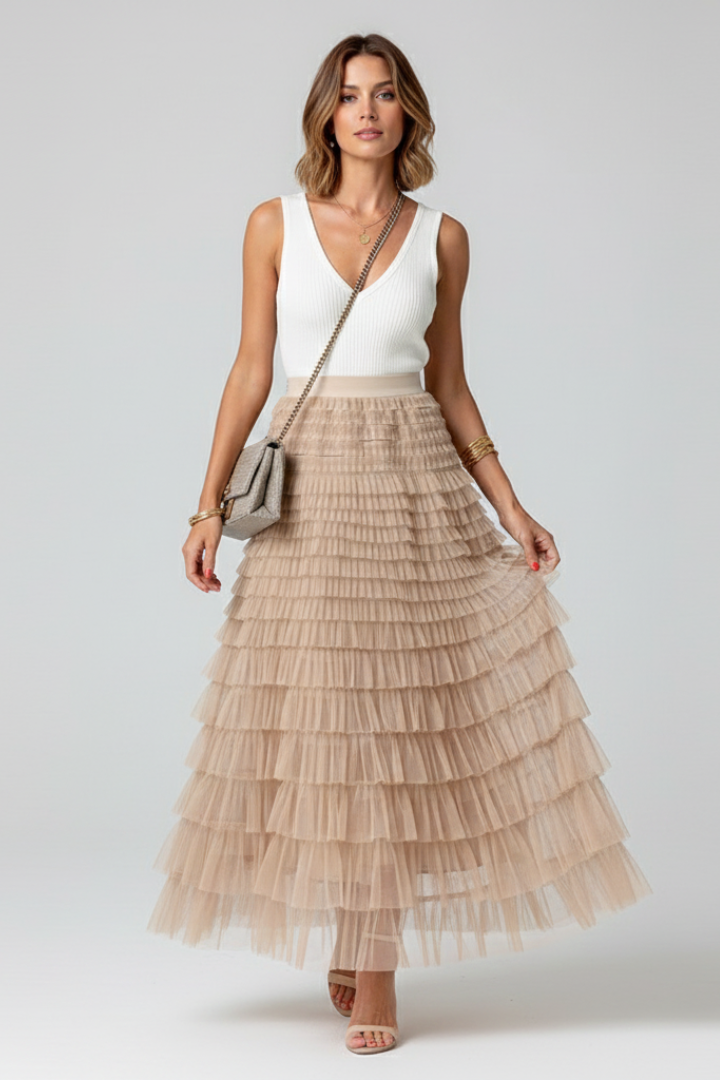 Flowy high waist A-line midi skirt for women. Features elegant tiered ruffles, ideal for occasion wear.