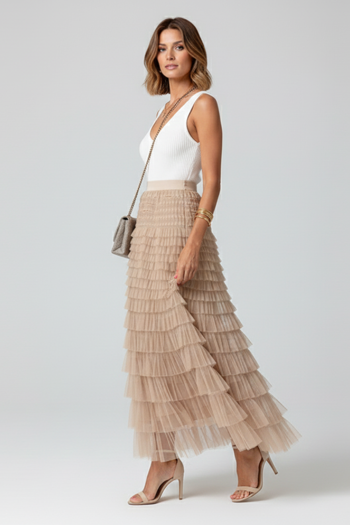 Feminine tiered ruffle midi skirt for women. This high waist design offers an elegant, comfortable, flowy fit.