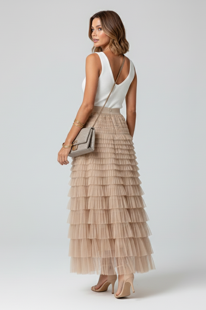 Women's elegant high waist midi skirt featuring beautiful tiered ruffles. A versatile A-line design for any event.
