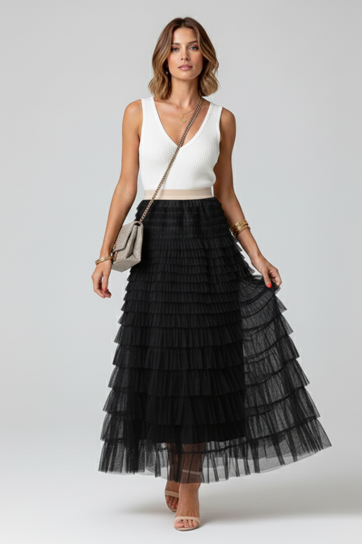 Chic women's midi skirt with a high waist & layered ruffles. This elegant, flowy piece suits formal or casual wear.