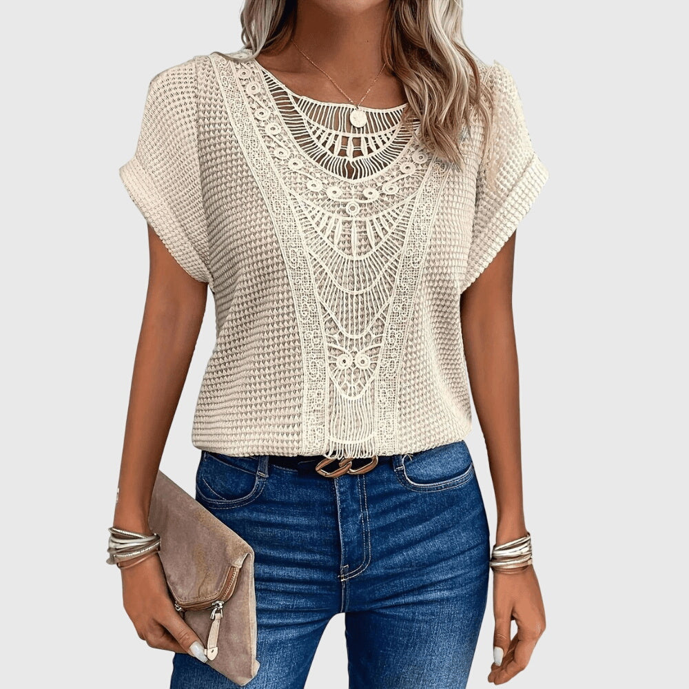 Women's elegant Ibiza style blouse with delicate lace details, perfect for summer chic fashion.