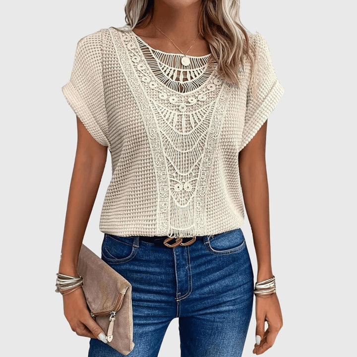 Women's elegant Ibiza style blouse with delicate lace details, perfect for summer chic fashion.