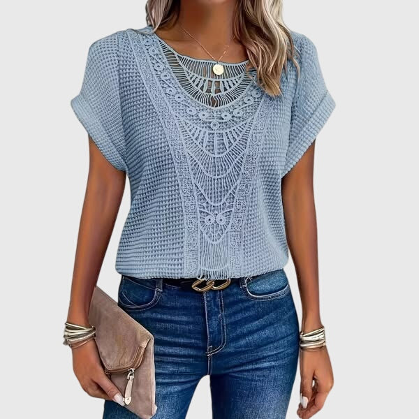 Women's versatile summer top, elegant and bohemian with lace details, reflecting Ibiza style.