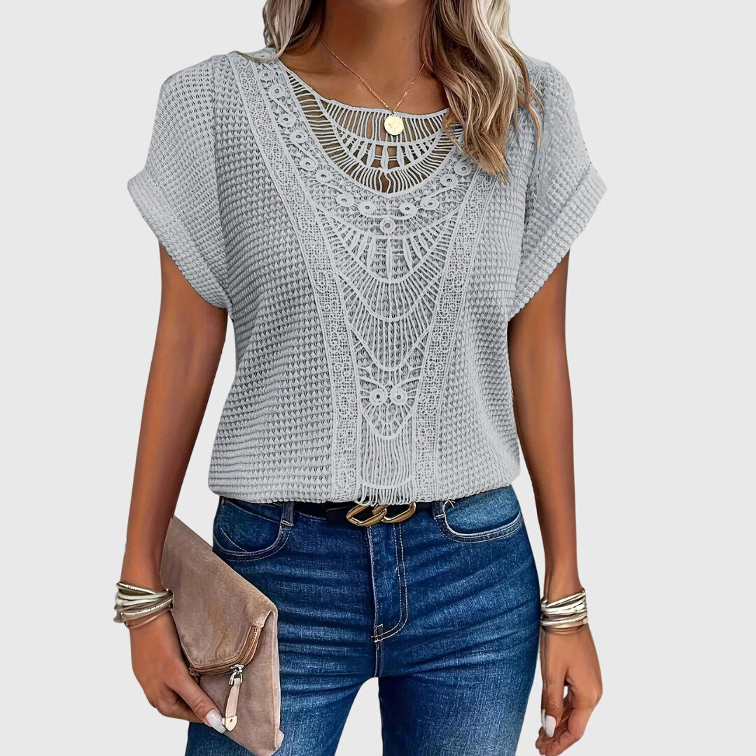 Chic women's Ibiza style top with elegant lace, perfect for a sophisticated summer look.