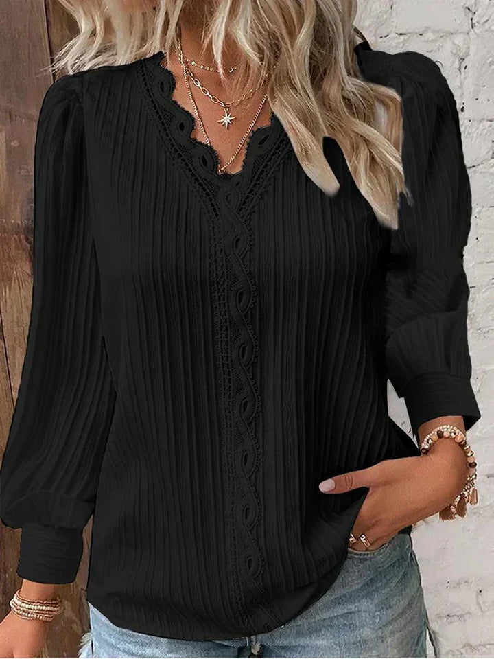 Women's elegant lace accent blouse with puff sleeves, perfect for versatile spring and summer fashion.